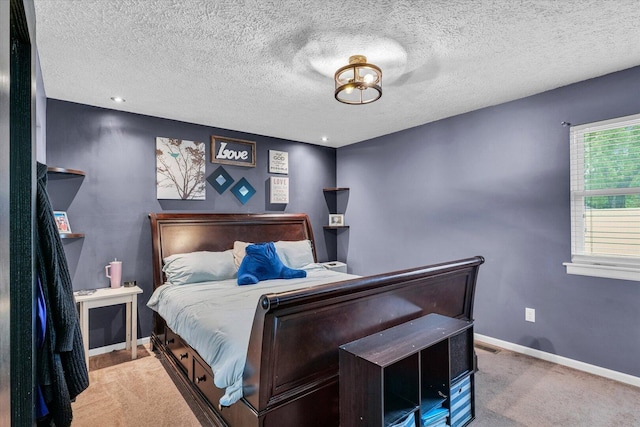 956 E Orleans St, Paxton, IL 60957 - carpeted bedroom featuring baseboards and a textured ceiling