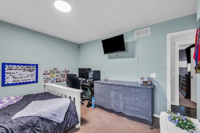 956 E Orleans St, Paxton, IL 60957 - carpeted bedroom with a desk and a textured ceiling