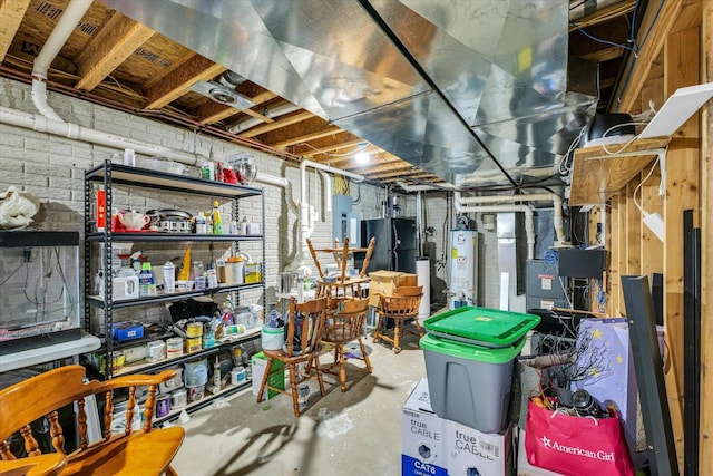 956 E Orleans St, Paxton, IL 60957 - unfinished basement with gas water heater, electric panel, heating unit, and freestanding refrigerator