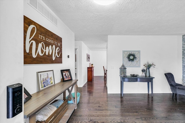 956 E Orleans St, Paxton, IL 60957 - corridor with wood finished floors, a textured ceiling, and baseboards