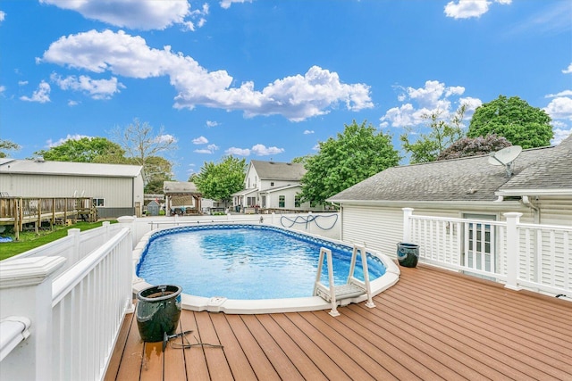956 E Orleans St, Paxton, IL 60957 - outdoor pool featuring a wooden deck and a residential view