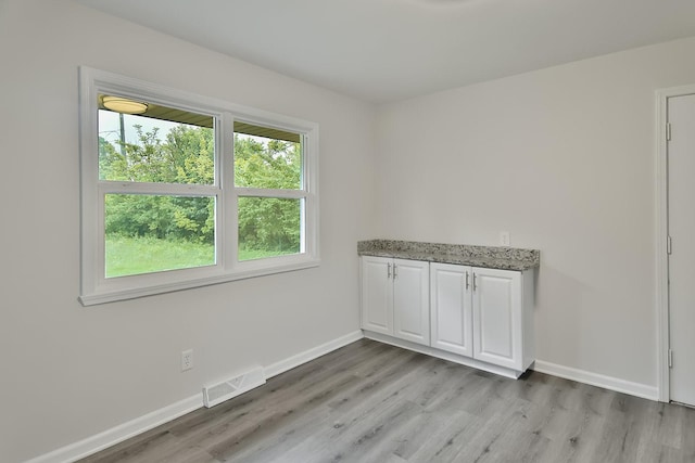1726 5th Ave, Belvidere, IL 61008 - unfurnished room with light wood-style floors and baseboards