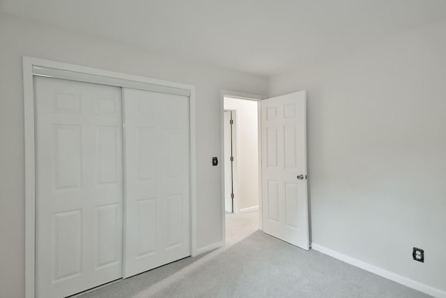 1726 5th Ave, Belvidere, IL 61008 - unfurnished bedroom featuring carpet, baseboards, and a closet