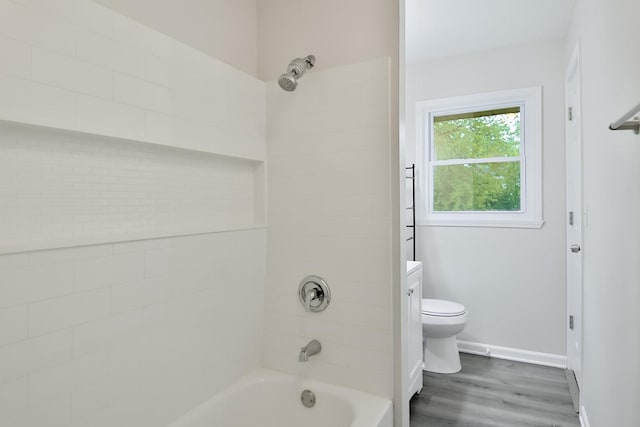 1726 5th Ave, Belvidere, IL 61008 - bathroom featuring toilet, shower / bath combination, wood finished floors, and baseboards