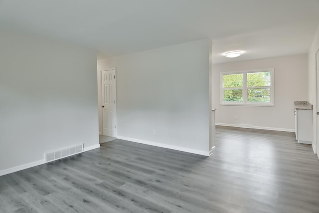 1726 5th Ave, Belvidere, IL 61008 - empty room with dark wood-style floors and baseboards