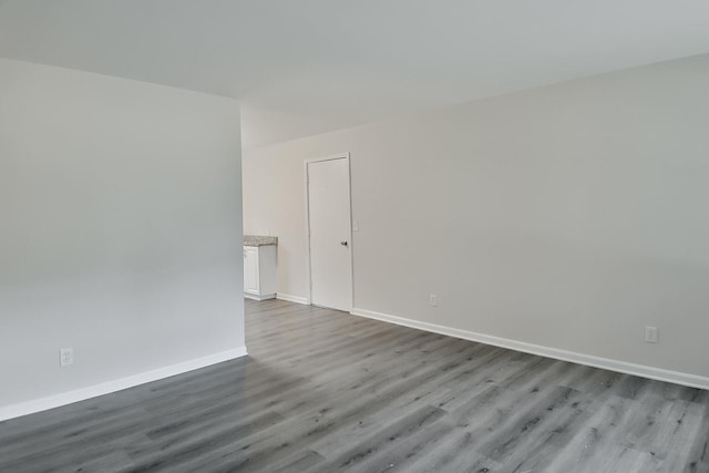 1726 5th Ave, Belvidere, IL 61008 - unfurnished room with wood finished floors and baseboards