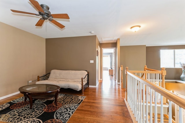 13555 Golden Eagle Cir, Plainfield, IL 60544 - sitting room featuring an upstairs landing, wood finished floors, a ceiling fan, baseboards, and attic access