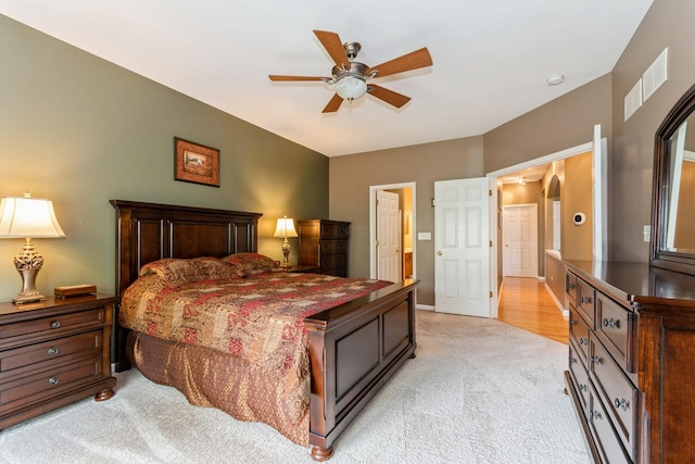 13555 Golden Eagle Cir, Plainfield, IL 60544 - bedroom with light carpet, arched walkways, and a ceiling fan
