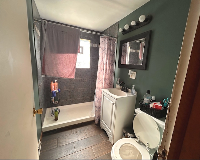 618 Emerald Ave, Chicago Heights, IL 60411 - full bathroom with toilet, vanity, and tiled shower