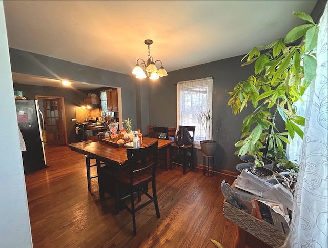 618 Emerald Ave, Chicago Heights, IL 60411 - dining room with wood finished floors and a chandelier