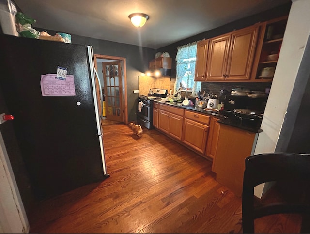 618 Emerald Ave, Chicago Heights, IL 60411 - kitchen with stainless steel appliances, dark wood-style floors, dark countertops, backsplash, and a sink