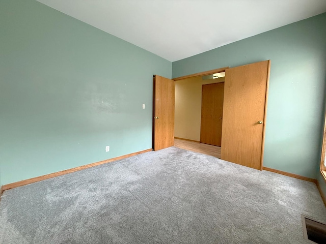 727 S Ashland Ave Unit C, Chicago, IL 60607 - unfurnished bedroom featuring carpet and baseboards