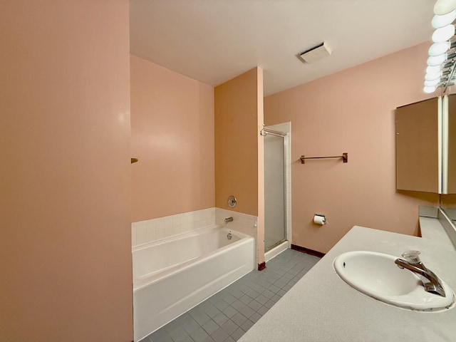 727 S Ashland Ave Unit C, Chicago, IL 60607 - full bathroom featuring tile patterned floors, a bath, vanity, a shower with door, and baseboards