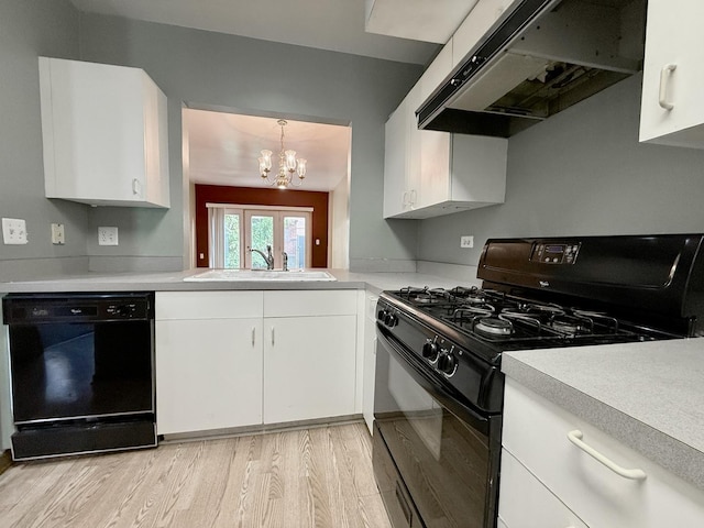 727 S Ashland Ave Unit C, Chicago, IL 60607 - kitchen featuring black appliances, under cabinet range hood, a chandelier, light countertops, and a sink