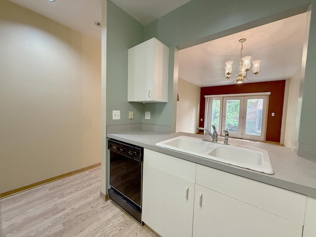 727 S Ashland Ave Unit C, Chicago, IL 60607 - kitchen featuring dishwasher, a chandelier, a sink, white cabinets, and light countertops