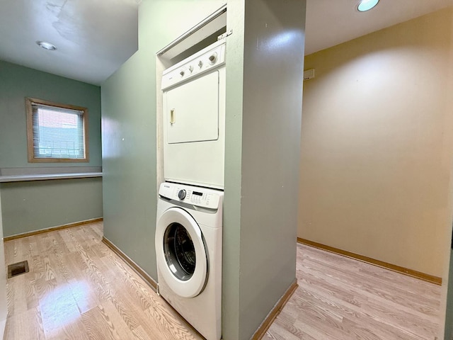727 S Ashland Ave Unit C, Chicago, IL 60607 - washroom with stacked washer / drying machine, light wood-type flooring, and baseboards