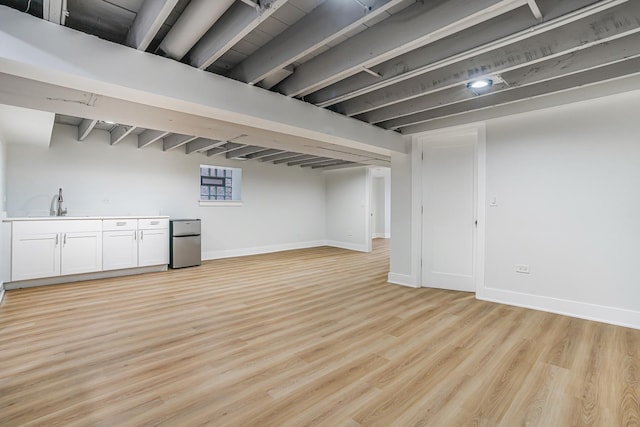 5823 S Francisco Ave, Chicago, IL 60629 - finished below grade area with fridge, light wood-style flooring, baseboards, and a sink