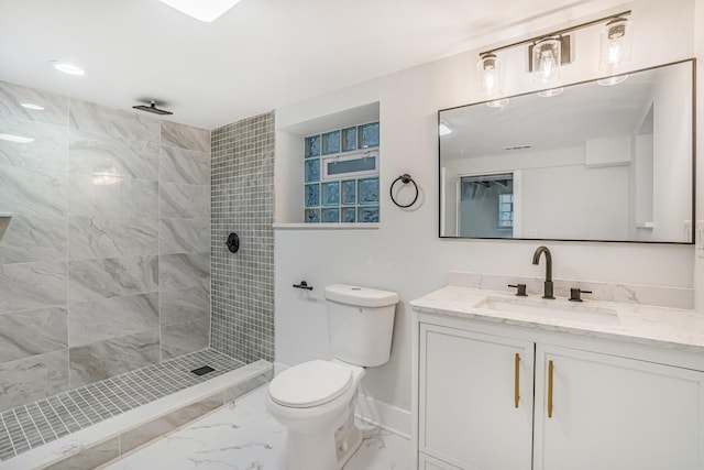 5823 S Francisco Ave, Chicago, IL 60629 - bathroom featuring marble look tiles, vanity, toilet, tiled shower, and baseboards