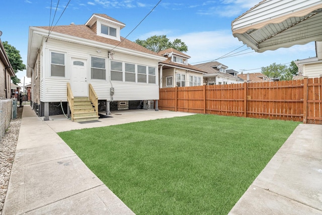 5823 S Francisco Ave, Chicago, IL 60629 - rear view of house featuring entry steps, a patio area, and roof with shingles