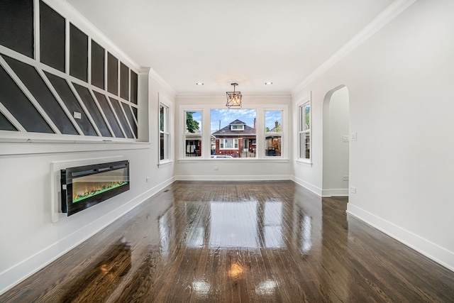 5823 S Francisco Ave, Chicago, IL 60629 - unfurnished living room with a glass covered fireplace, ornamental molding, arched walkways, dark wood-style floors, and baseboards