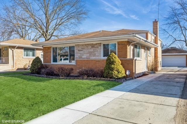 16361 Greenwood Ave, South Holland, IL 60473 - view of front facade with a chimney, brick siding, an outdoor structure, a front yard, and a detached garage
