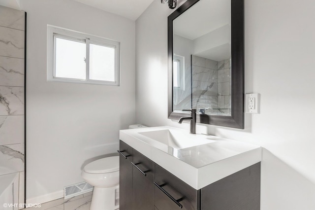 16361 Greenwood Ave, South Holland, IL 60473 - full bathroom with marble look tile flooring, toilet, vanity, a shower, and baseboards