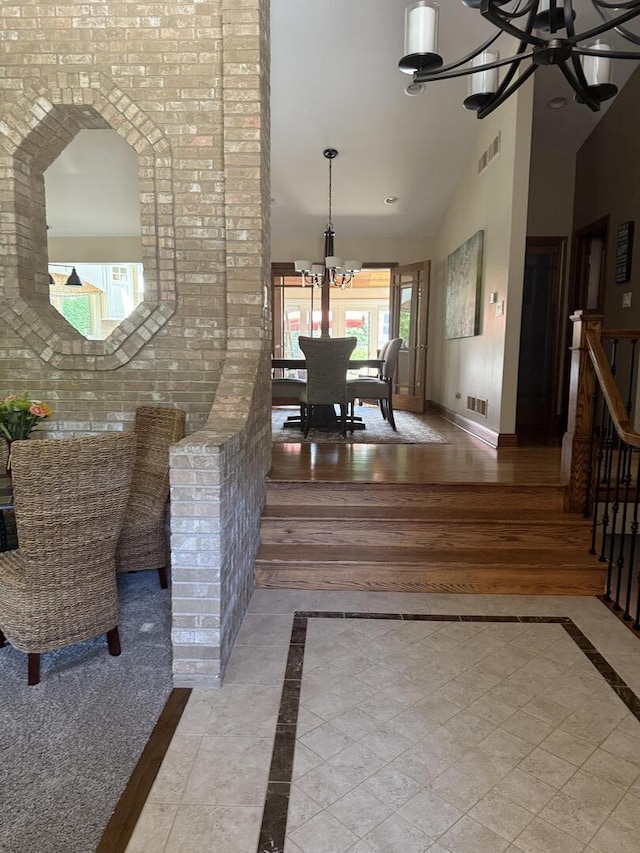 10348 Woburn Ct, Orland Park, IL 60462 - interior space with a chandelier, inlaid floor details, recessed lighting, vaulted ceiling, and baseboards