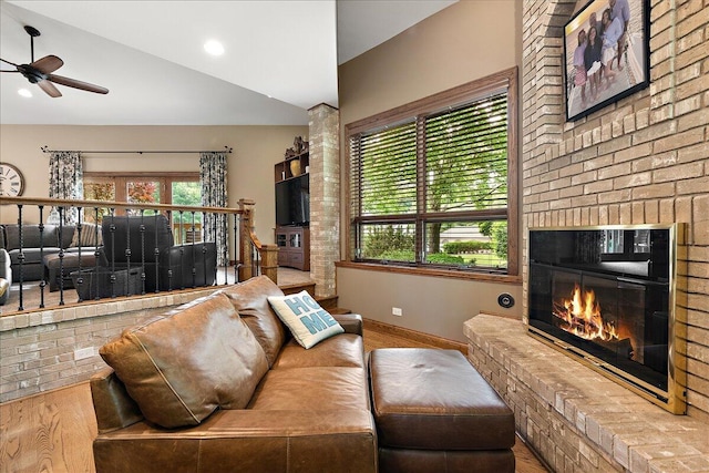10348 Woburn Ct, Orland Park, IL 60462 - living area with wood finished floors, ceiling fan, vaulted ceiling, and a brick fireplace