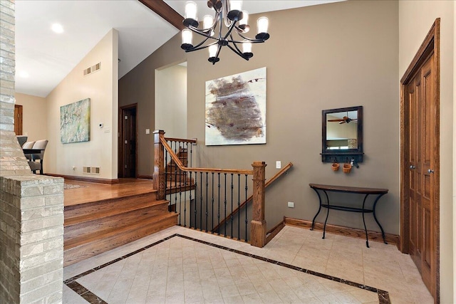10348 Woburn Ct, Orland Park, IL 60462 - stairway with inlaid floor details, a chandelier, and high vaulted ceiling
