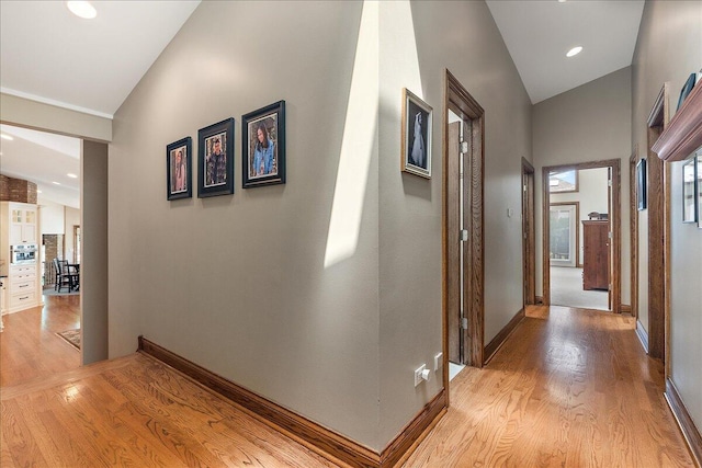 10348 Woburn Ct, Orland Park, IL 60462 - corridor with lofted ceiling and light wood-style floors