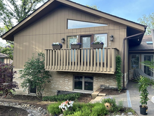 10348 Woburn Ct, Orland Park, IL 60462 - view of side of home featuring a balcony and brick siding