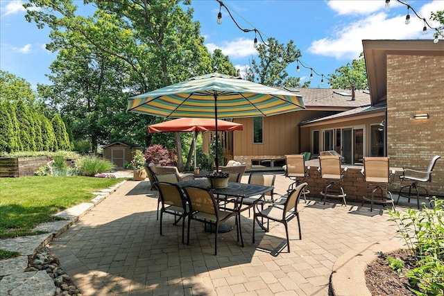10348 Woburn Ct, Orland Park, IL 60462 - view of patio featuring outdoor dining space and a shed