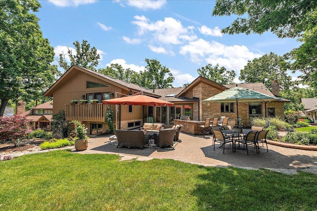 10348 Woburn Ct, Orland Park, IL 60462 - rear view of property with an outdoor hangout area, a lawn, a patio, a chimney, and brick siding