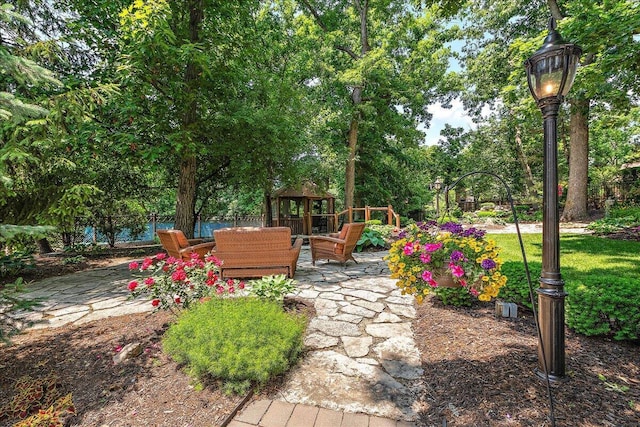 10348 Woburn Ct, Orland Park, IL 60462 - view of patio with a gazebo and view of wooded area