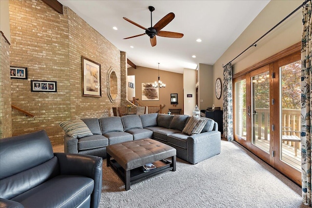 10348 Woburn Ct, Orland Park, IL 60462 - living room featuring carpet flooring, brick wall, a chandelier, ceiling fan, and high vaulted ceiling