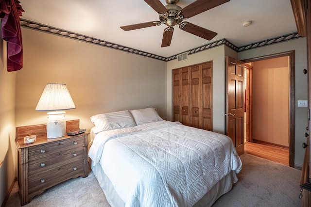 1027 Fairway Dr, Fox Lake, IL 60020 - bedroom featuring light colored carpet, a closet, and a ceiling fan