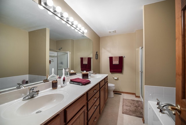 1027 Fairway Dr, Fox Lake, IL 60020 - bathroom featuring a stall shower, double vanity, a garden tub, toilet, and tile patterned floors
