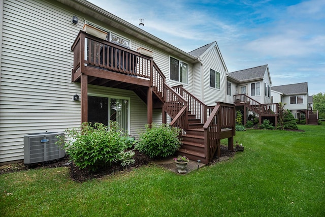 1027 Fairway Dr, Fox Lake, IL 60020 - rear view of property with central AC, stairway, a wooden deck, and a lawn