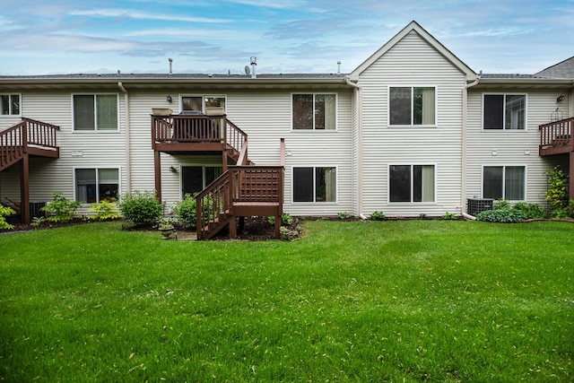 1027 Fairway Dr, Fox Lake, IL 60020 - back of house featuring stairs, a lawn, and cooling unit