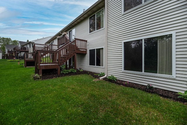 1027 Fairway Dr, Fox Lake, IL 60020 - back of property with stairway, a yard, and a wooden deck