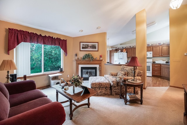 1027 Fairway Dr, Fox Lake, IL 60020 - living room with light colored carpet, vaulted ceiling, a glass covered fireplace, and baseboards