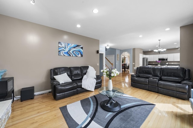 2008 Snow Creek Rd, Naperville, IL 60564 - living area with a chandelier, light wood-type flooring, stairway, arched walkways, and recessed lighting