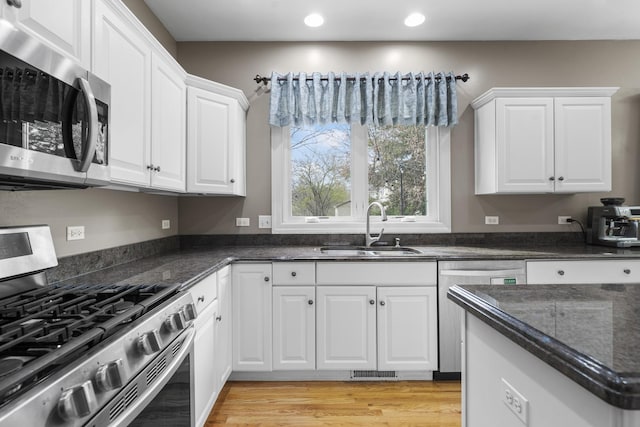 2008 Snow Creek Rd, Naperville, IL 60564 - kitchen featuring appliances with stainless steel finishes, a sink, recessed lighting, white cabinets, and light wood-style floors