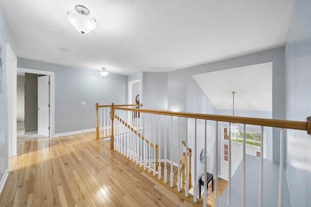 2008 Snow Creek Rd, Naperville, IL 60564 - corridor with an upstairs landing, light wood-style flooring, and baseboards