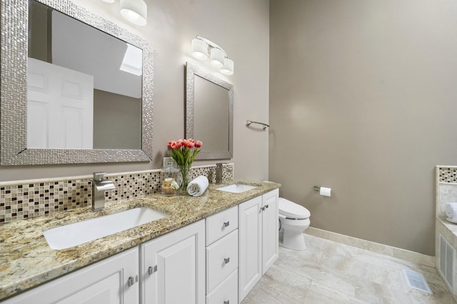 2008 Snow Creek Rd, Naperville, IL 60564 - bathroom featuring double vanity, toilet, tasteful backsplash, and baseboards