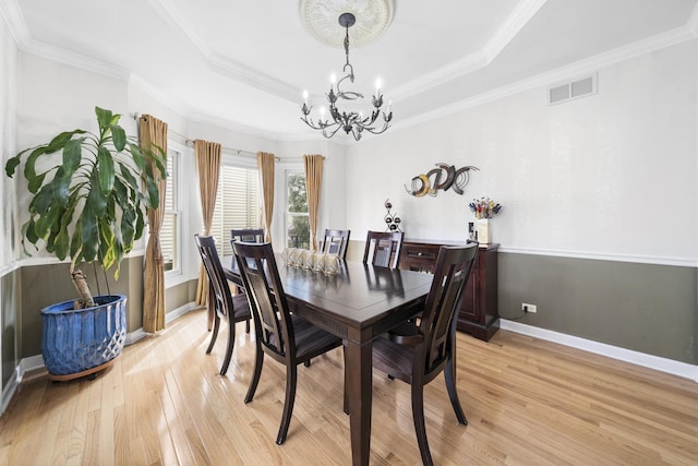 2008 Snow Creek Rd, Naperville, IL 60564 - dining space featuring light wood-style flooring, a chandelier, a tray ceiling, ornamental molding, and baseboards