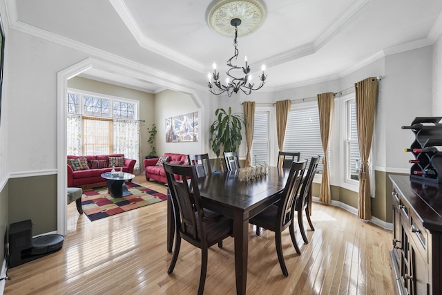 2008 Snow Creek Rd, Naperville, IL 60564 - dining space featuring light wood-type flooring, a chandelier, a raised ceiling, crown molding, and baseboards