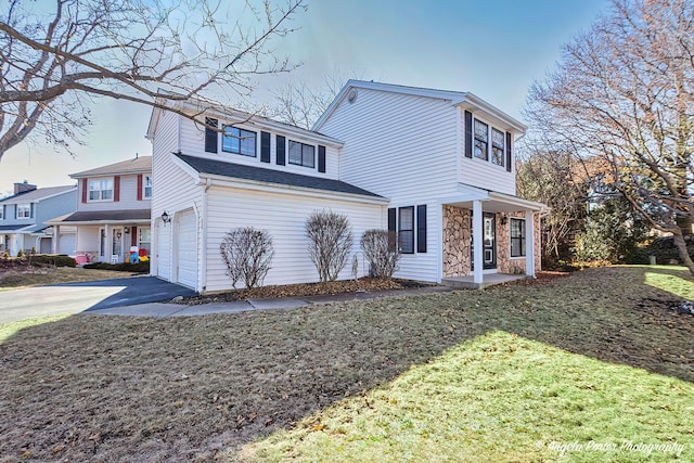 638 Dordan Ct, Gurnee, IL 60031 - view of front of home with concrete driveway, an attached garage, stone siding, and a front lawn