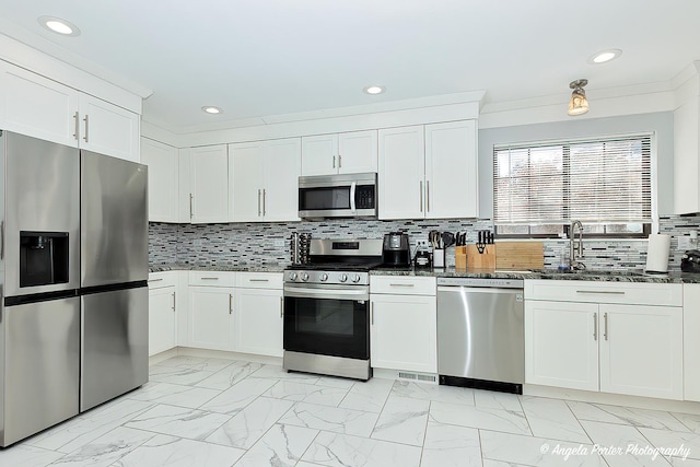 638 Dordan Ct, Gurnee, IL 60031 - kitchen featuring stainless steel appliances, light marble finish flooring, recessed lighting, white cabinets, and dark stone countertops