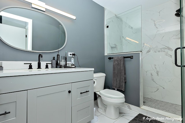 638 Dordan Ct, Gurnee, IL 60031 - bathroom featuring marble look tiles, toilet, a marble finish shower, and vanity